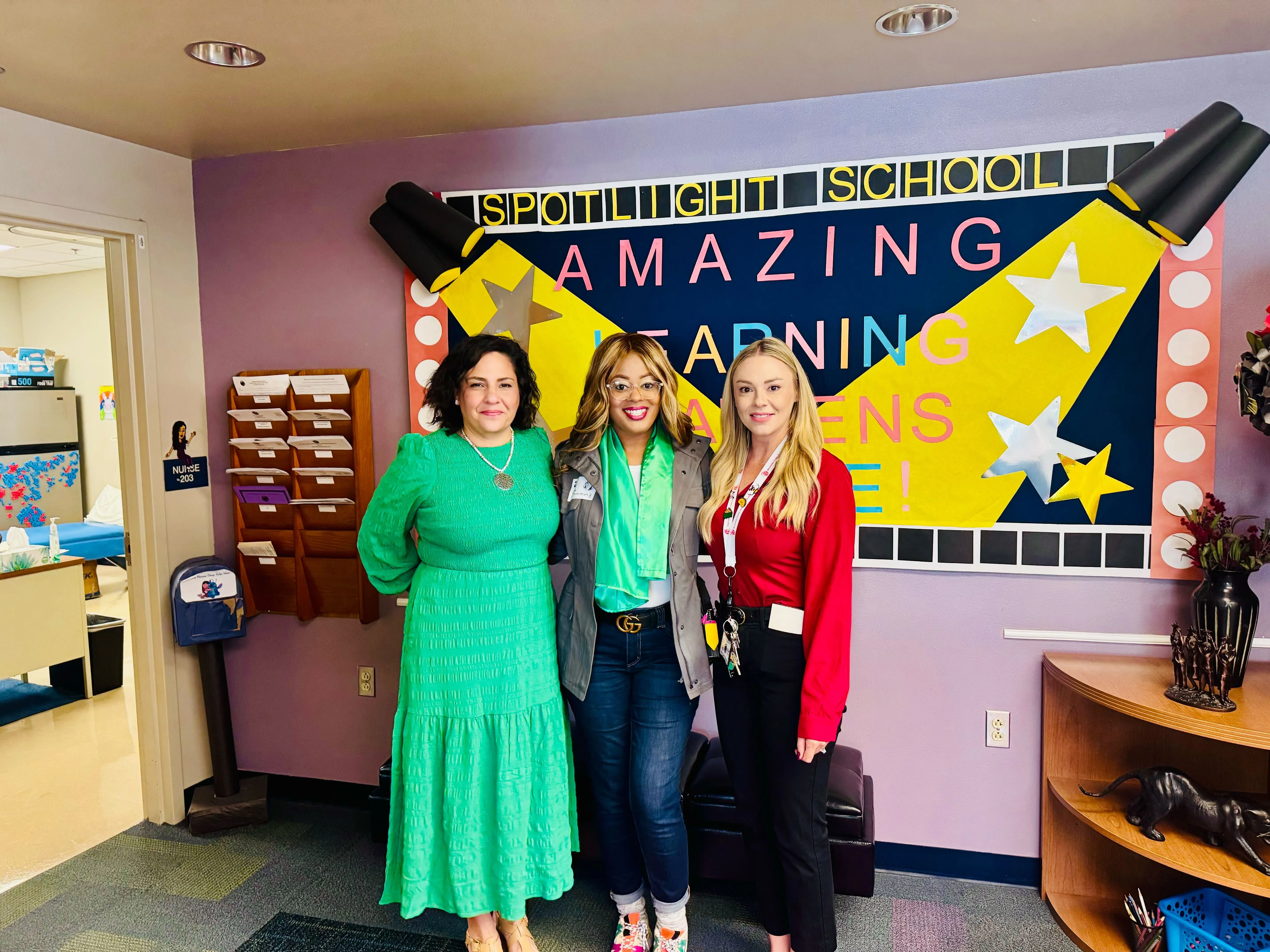 Educators celebrating reading together in a classroom
